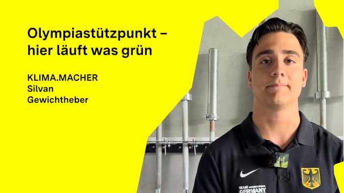 Silvan Sahin blickt in die Kamera, hinter ihm Hantelstangen im Olympia-Stützpunkt Heidelberg.